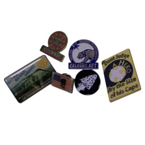 group of assorted enamel badges