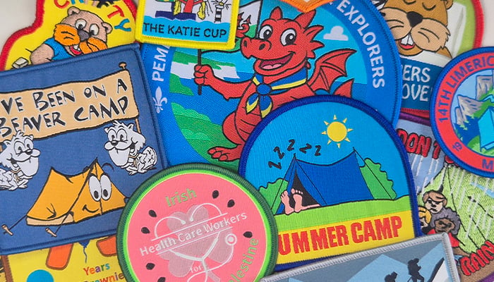 assorted custom scout badges